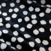 Wellnessfleece Dots schwarz ecru